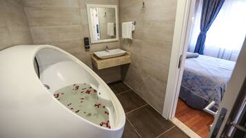 Deep soaking tub, free toiletries, hair dryer, bathrobes