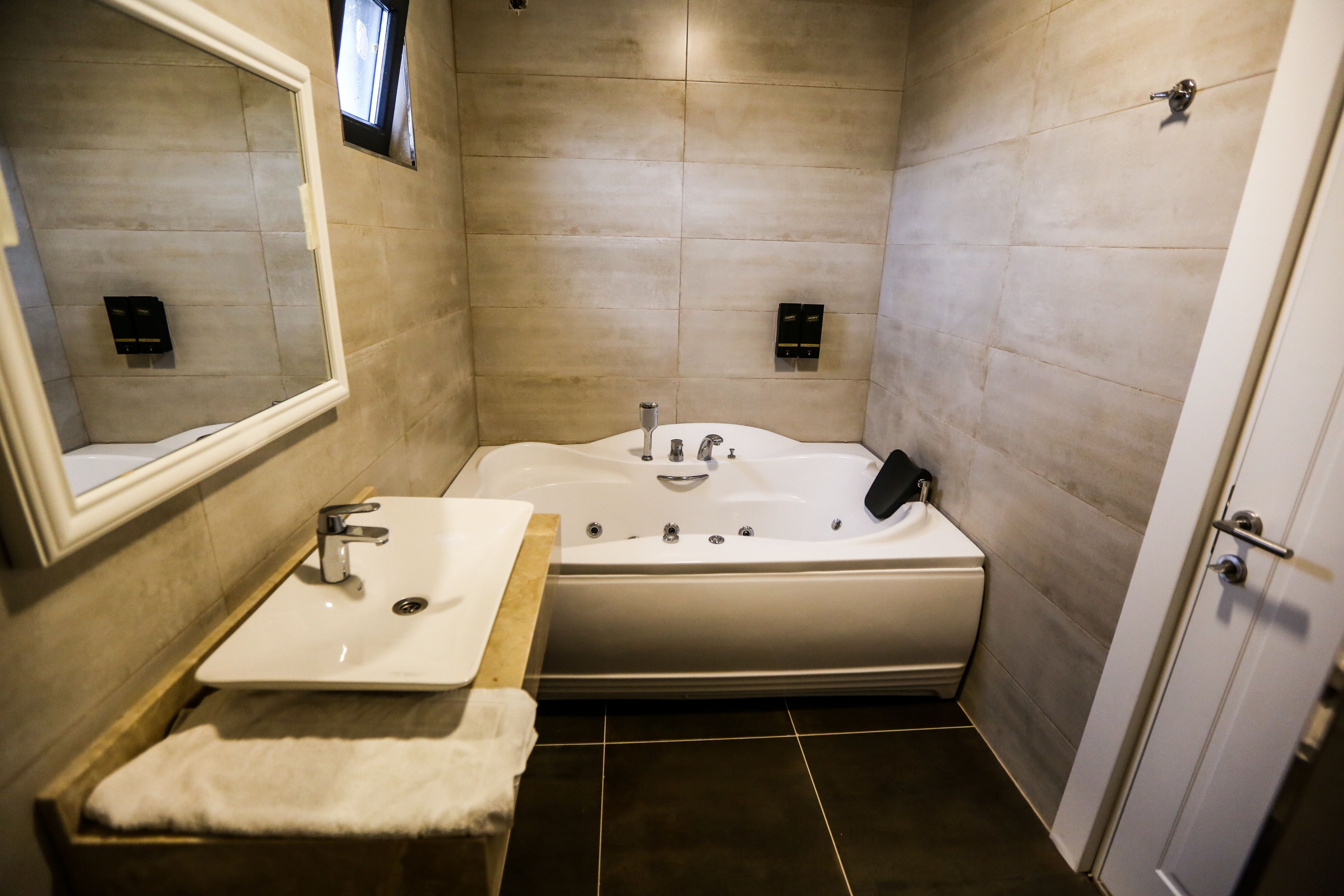 suite, jetted tub | bathroom | deep-soaking bathtub, free toiletries, hair dryer, bathrobes