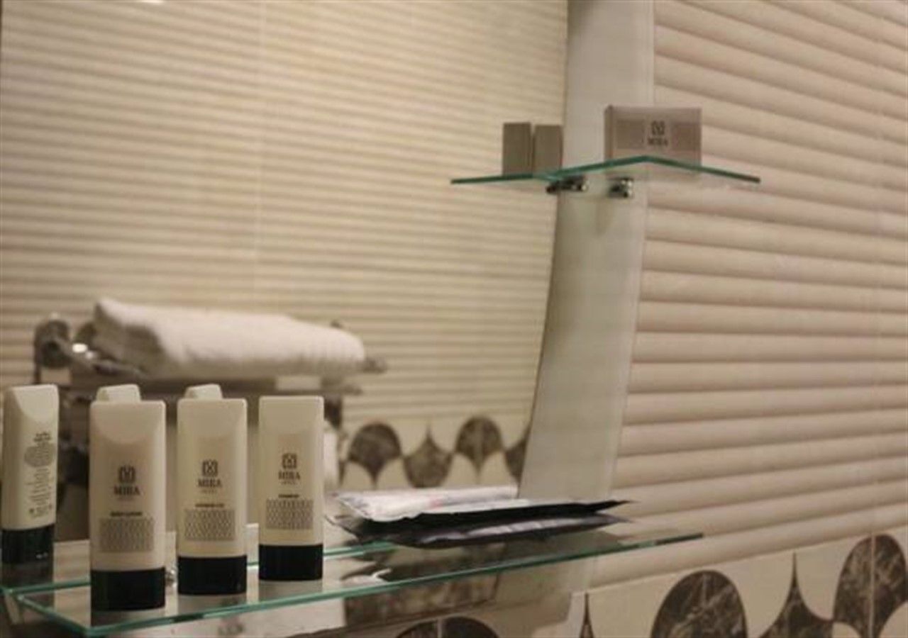 designer toiletries, hair dryer, dressing gowns, slippers