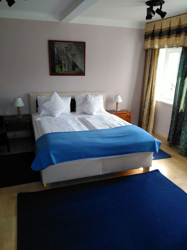 Desk, blackout curtains, iron/ironing board, rollaway beds