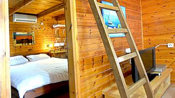 Cabin, 1 Bedroom | Living area | Flat-screen TV