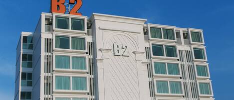 A multi-story building with a prominent 'B2' sign on the top.