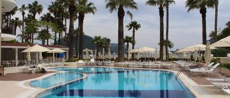 Indoor pool, outdoor pool, pool umbrellas, pool loungers