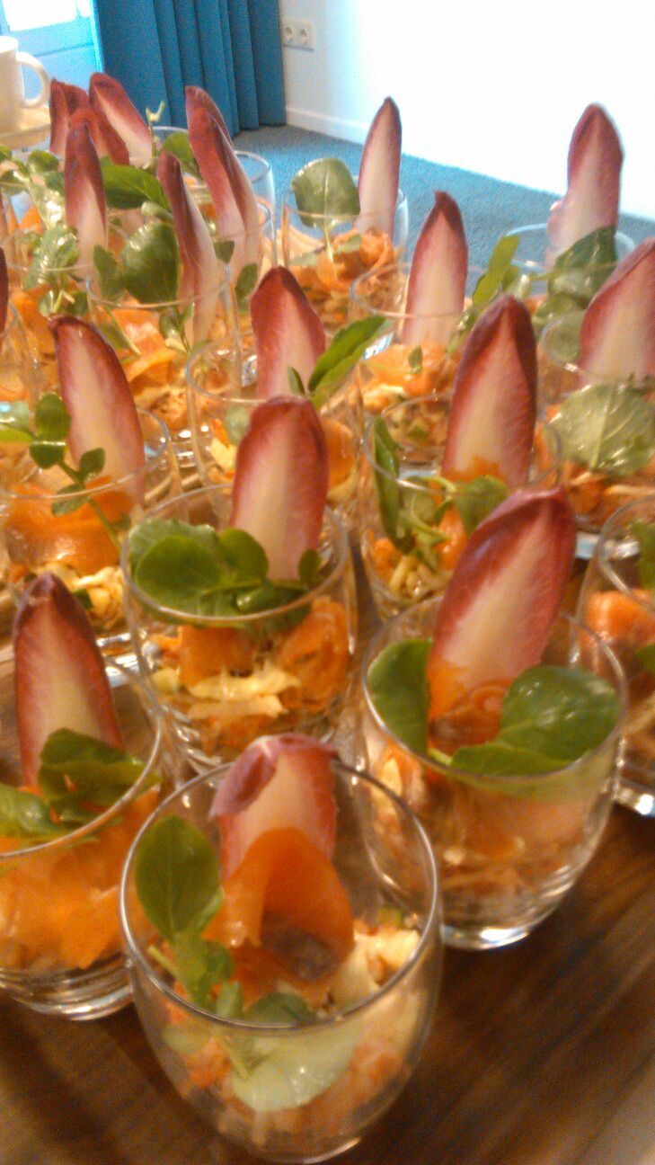 A tray of appetizers with various garnishes and ingredients.