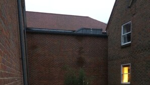 A brick building with a small grassy area and a concrete pathway. - 3 Summertown Court (Oxford)