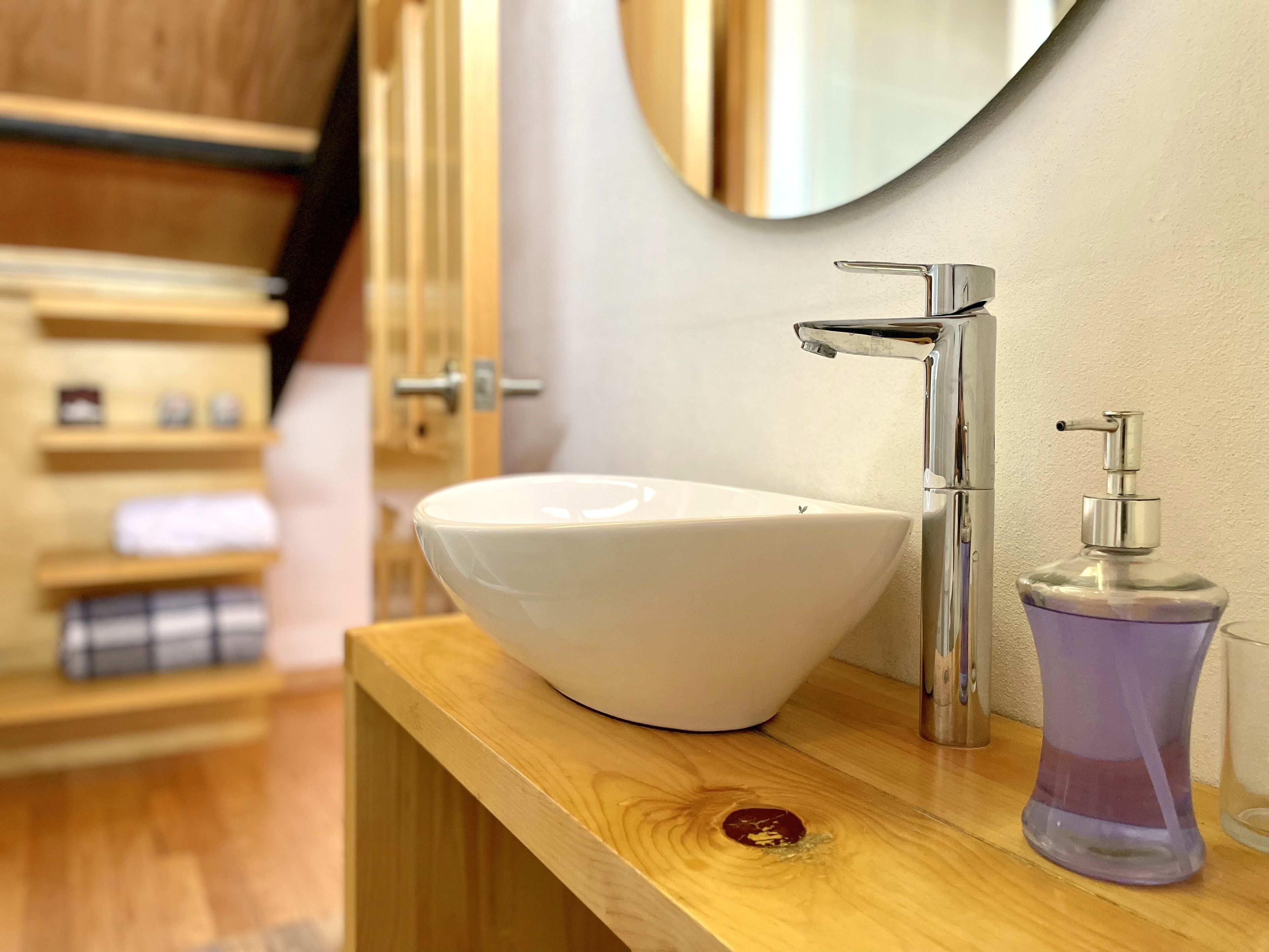 deluxe suite, 1 king bed | bathroom | shower, hair dryer, towels, soap