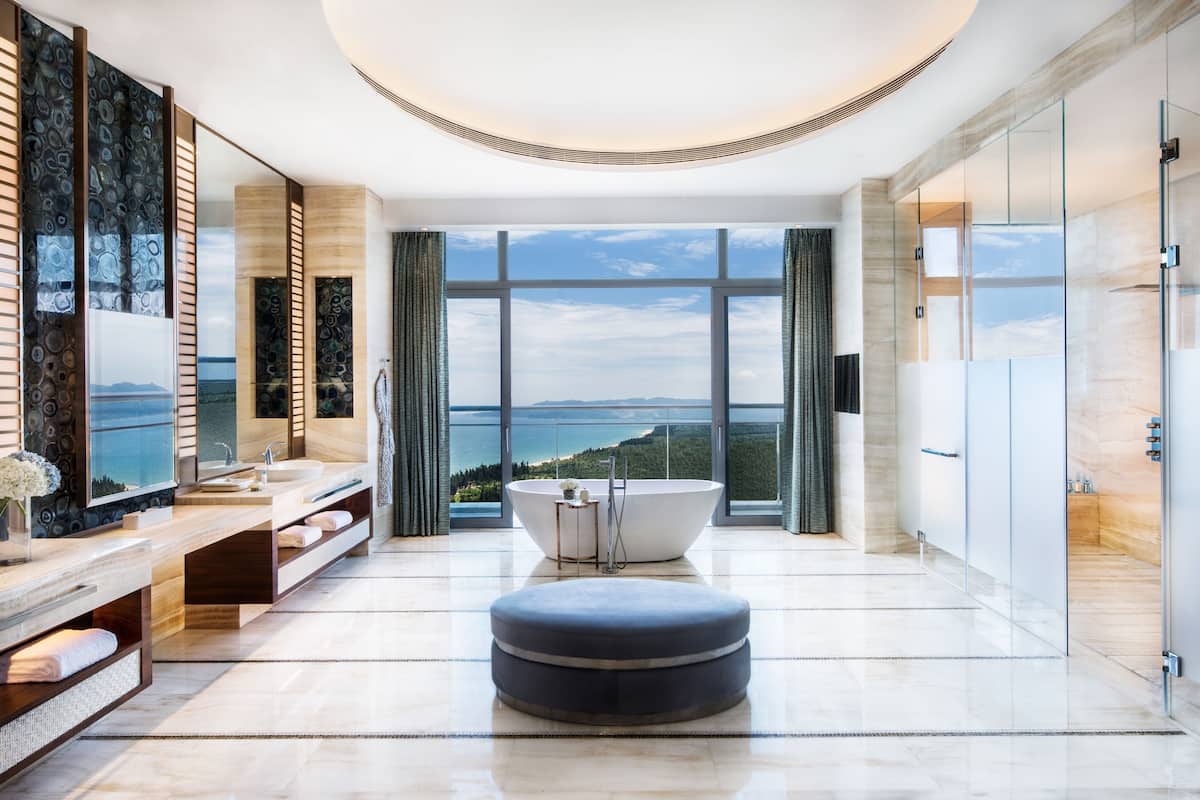 separate bathtub and shower, hair dryer, bathrobes, slippers