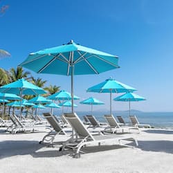 On the beach, sun-loungers, beach umbrellas, beach towels