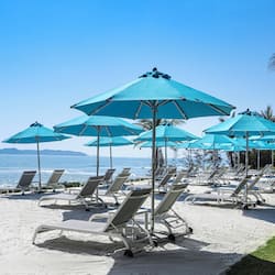 On the beach, sun-loungers, beach umbrellas, beach towels