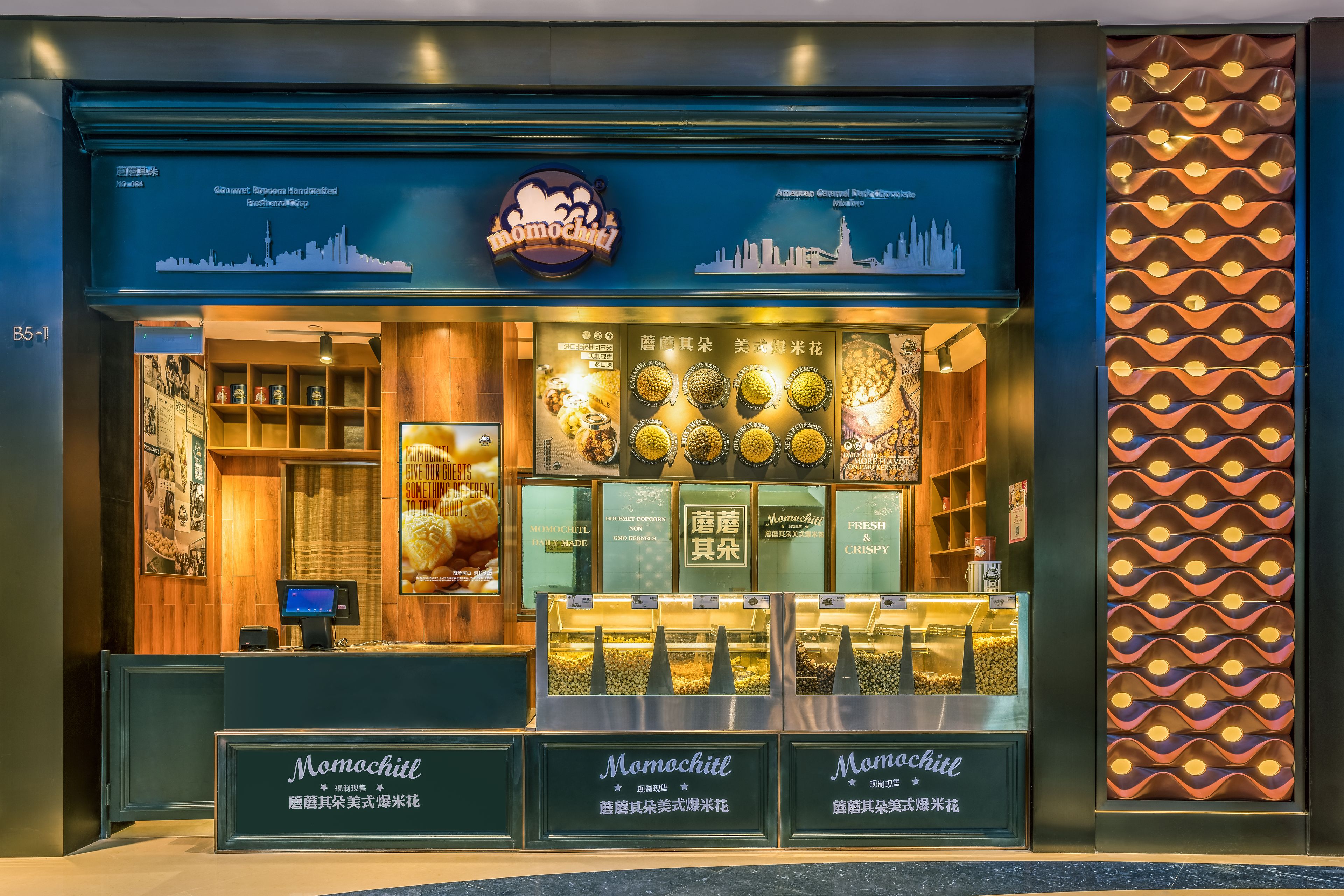 A storefront with a city skyline graphic, a logo, and a display of products.