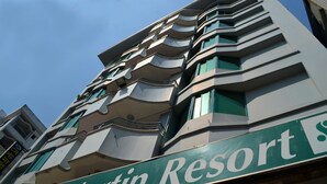 A multi-story building with a sign reading "Saint Martin Resort". - Saint Martin Resort (Cox's Bazar)