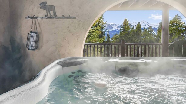 A hot tub with a view of snow-capped mountains. - Above the Fray (Breckenridge)