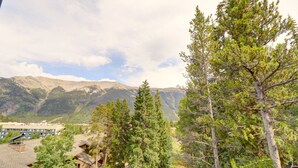 A mountainous landscape with a view of a lodge and surrounding trees. - CM417H Copper Mtn Inn Studio Bedroom 1Bathroom Hotel Room (Copper Mountain)