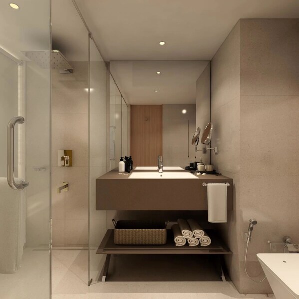 A modern bathroom with a glass shower enclosure, a built-in sink, and a vanity with a mirror. - Sayaji Vadodara (Vadodara)