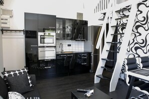 Deluxe Cabin, 2 Bedrooms | Private kitchen | Full-size fridge, microwave, oven, stovetop - Dragsö Camping & Stugby (Karlskrona)