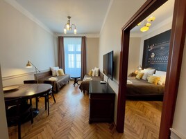 Classic Suite, 1 Bedroom, Kitchenette, City View | Premium bedding, in-room safe, laptop workspace, blackout drapes