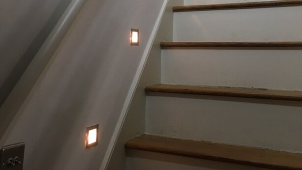 A staircase with wooden steps and recessed lighting. - The White House Wells 2 Park View (Wells)