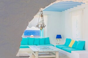 Deluxe Apartment, Pool Access, Sea View | Living room | Flat-screen TV - Cavo Nano (Mykonos)