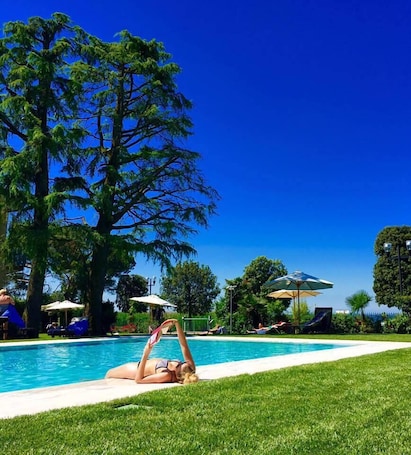 Seasonal outdoor pool, pool umbrellas, sun loungers