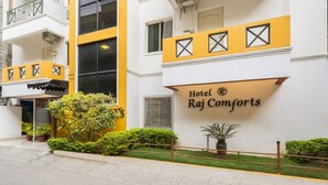 A hotel with a sign reading "Hotel Raj Comforts." - Hotel Raj Comforts - Golf View (Bengaluru)