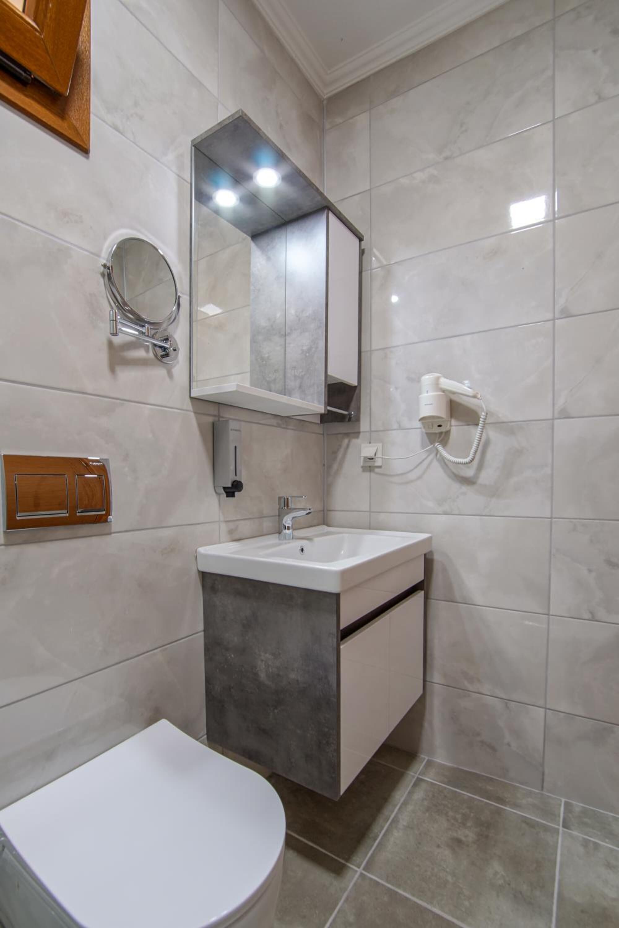 shower, hair dryer, slippers, towels