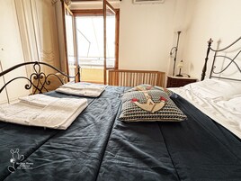 Family Apartment, 2 Bedrooms, Kitchenette, Sea View | Down comforters, individually decorated, individually furnished