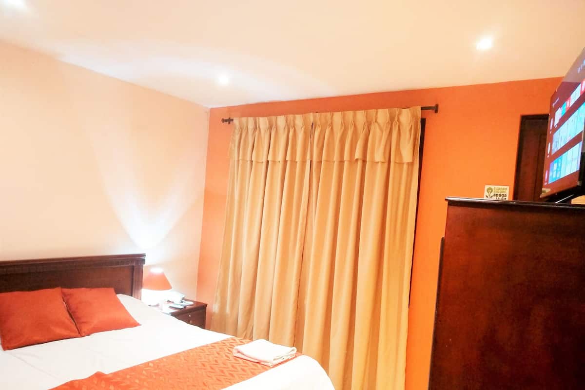 Premium bedding, down duvets, in-room safe, desk