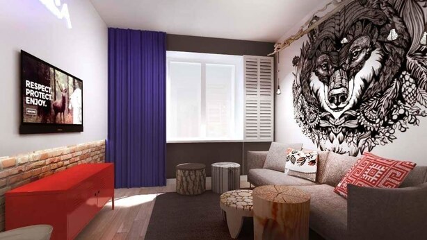 A modern living room with a grey sofa, red side table, and a large wall mural. - Go2Krynica - Gawra (Krynica-Zdroj)