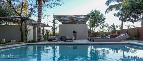 Outdoor pool, pool umbrellas, sun loungers