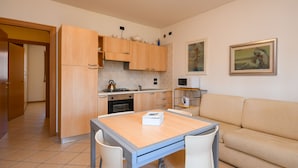 Apartment, 1 Bedroom, Balcony, Resort View | Living area | TV