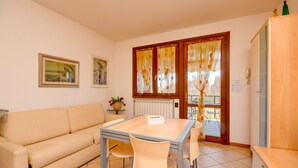 Apartment, 1 Bedroom, Balcony, Resort View | Living area | TV