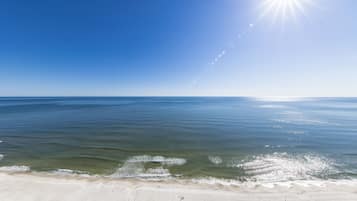 A beach with clear skies and calm waters.