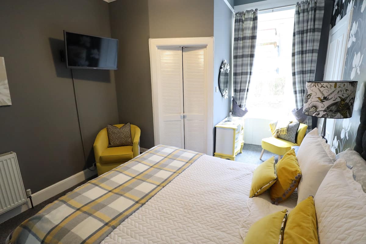 Premium bedding, blackout curtains, iron/ironing board, free WiFi