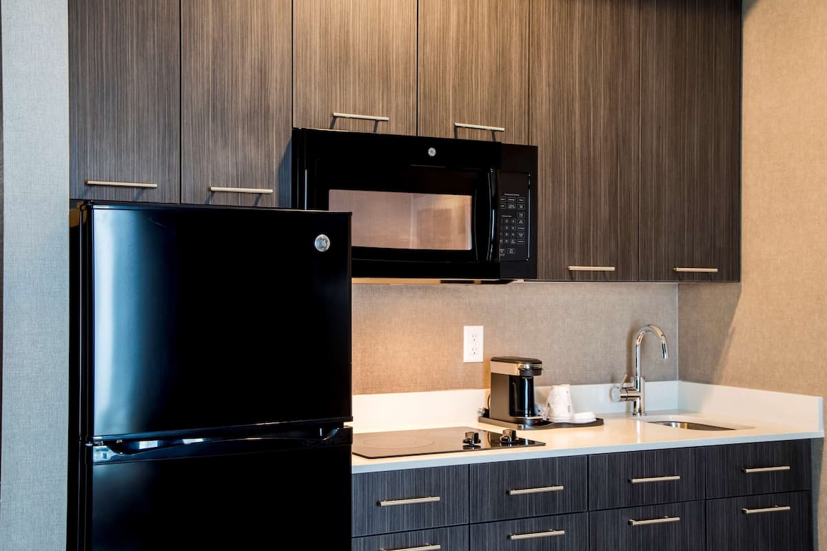 desk, laptop workspace, blackout curtains, iron/ironing board