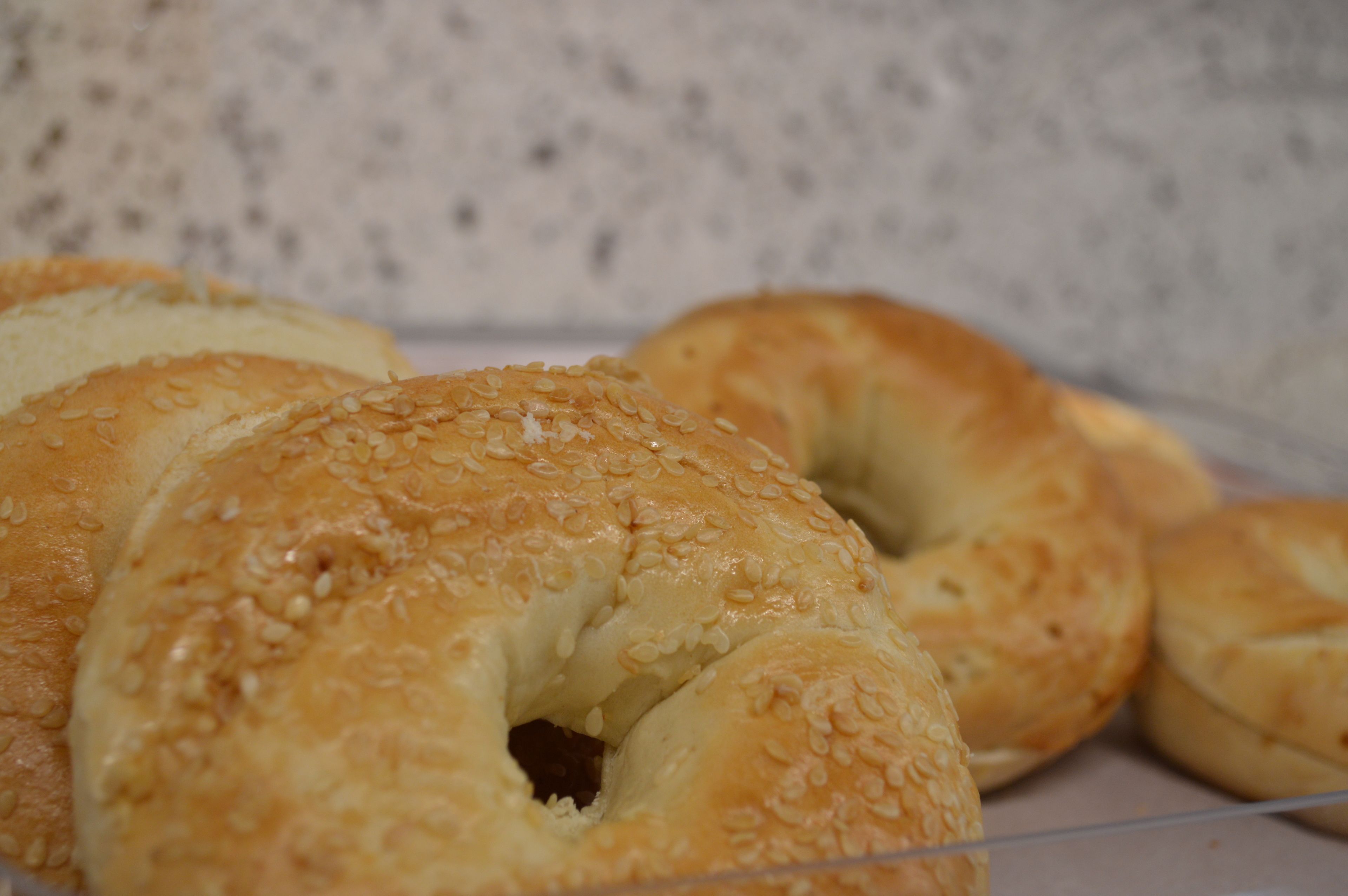 A close-up of bagels with sesame seeds.