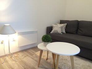 Apartamento | Sala de estar | Una televisión de pantalla plana