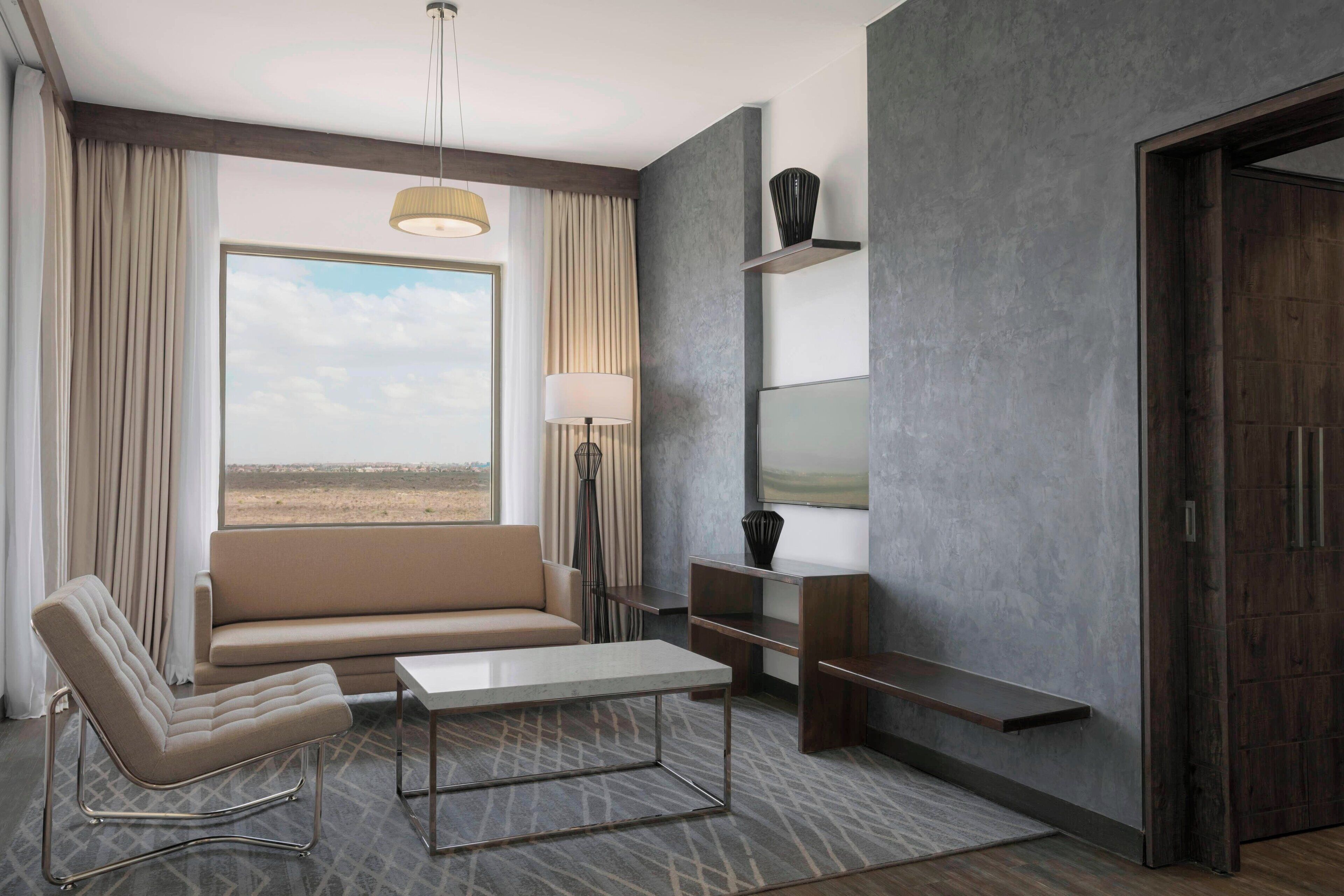 executive suite, 1 king bed, park view | living room | 42-inch led tv with cable channels, tv