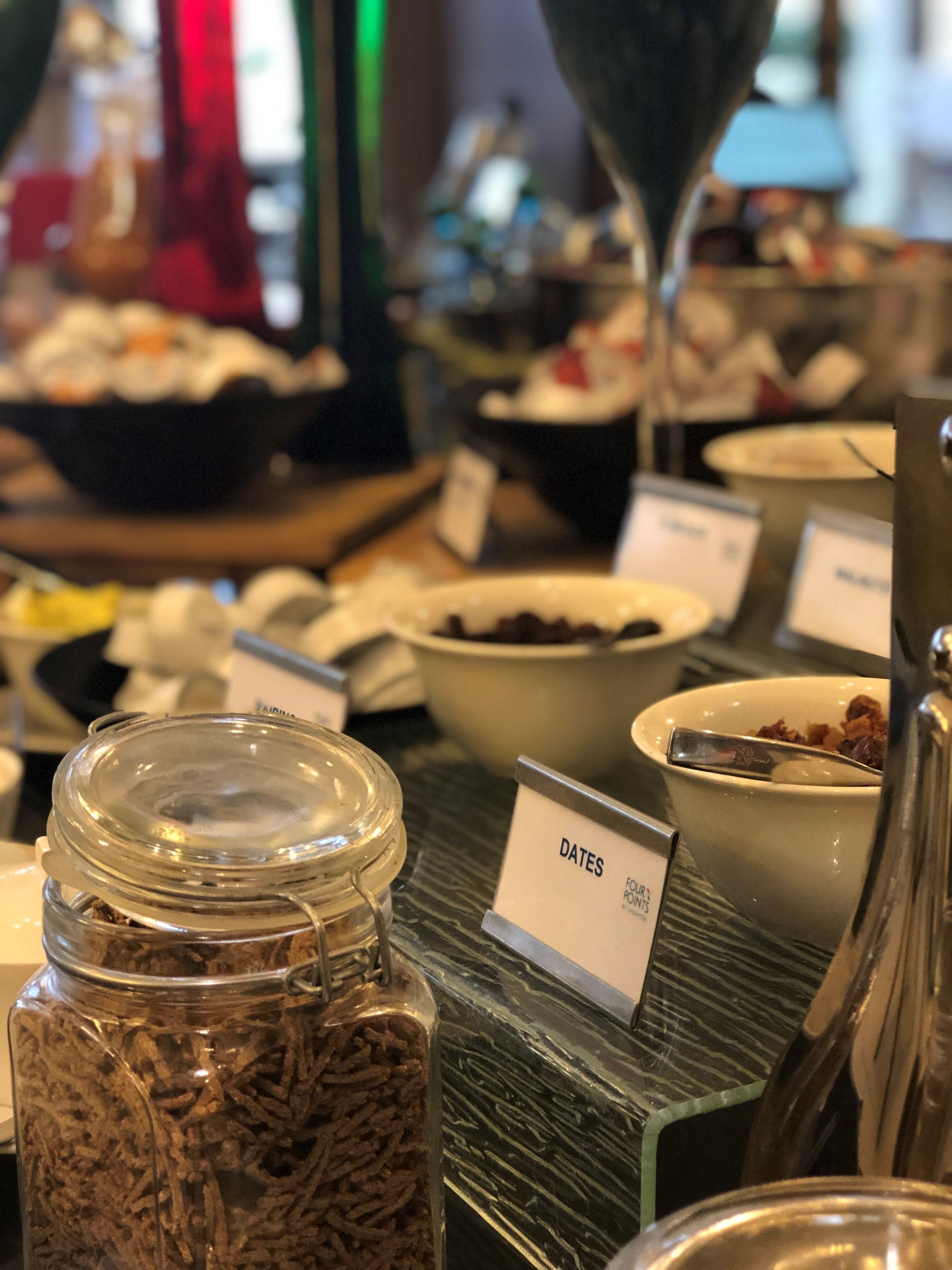 A buffet with various food items and a sign labeled "DATES".
