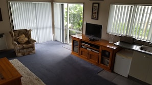 Apartment, 1 Bedroom | Living area | Flat-screen TV