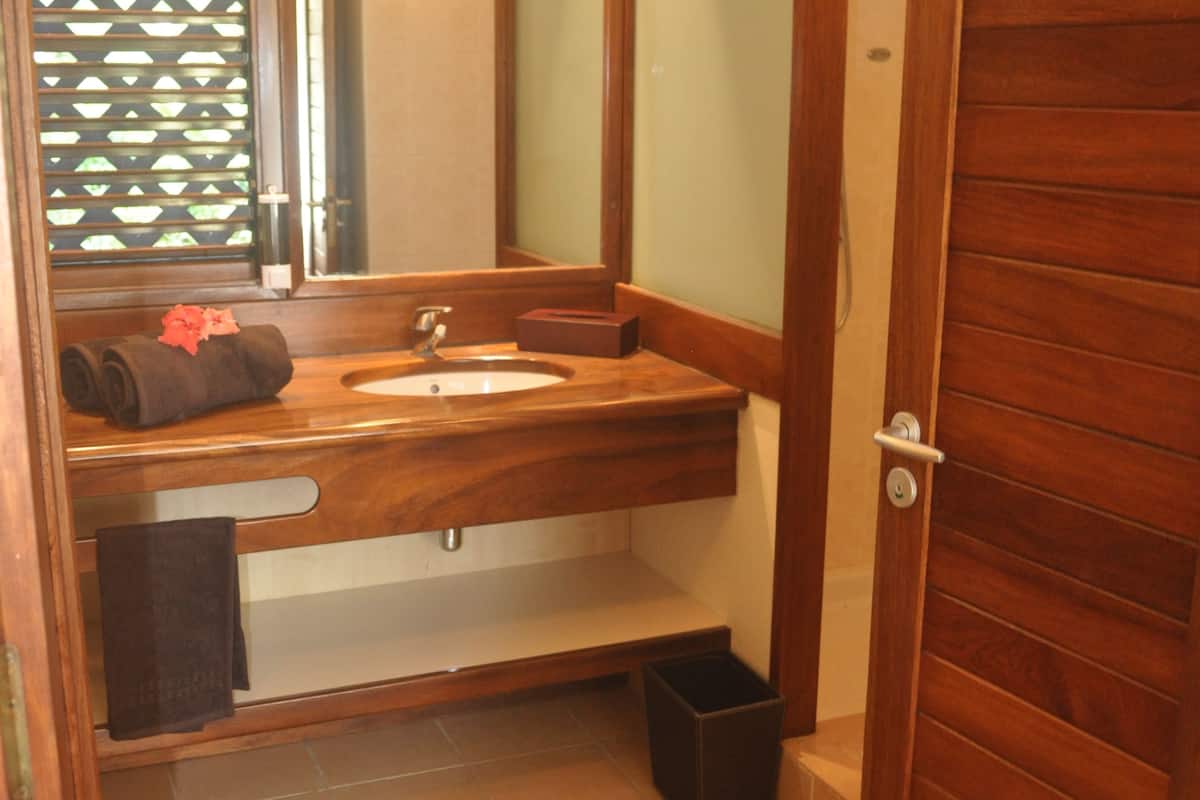 double room with garden view | bathroom | shower, free toiletries, hair dryer, towels