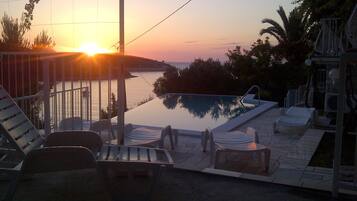 Outdoor pool, an infinity pool, open 8:00 AM to 9:00 PM, free cabanas