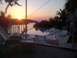 Outdoor pool, an infinity pool, open 8:00 AM to 9:00 PM, free cabanas