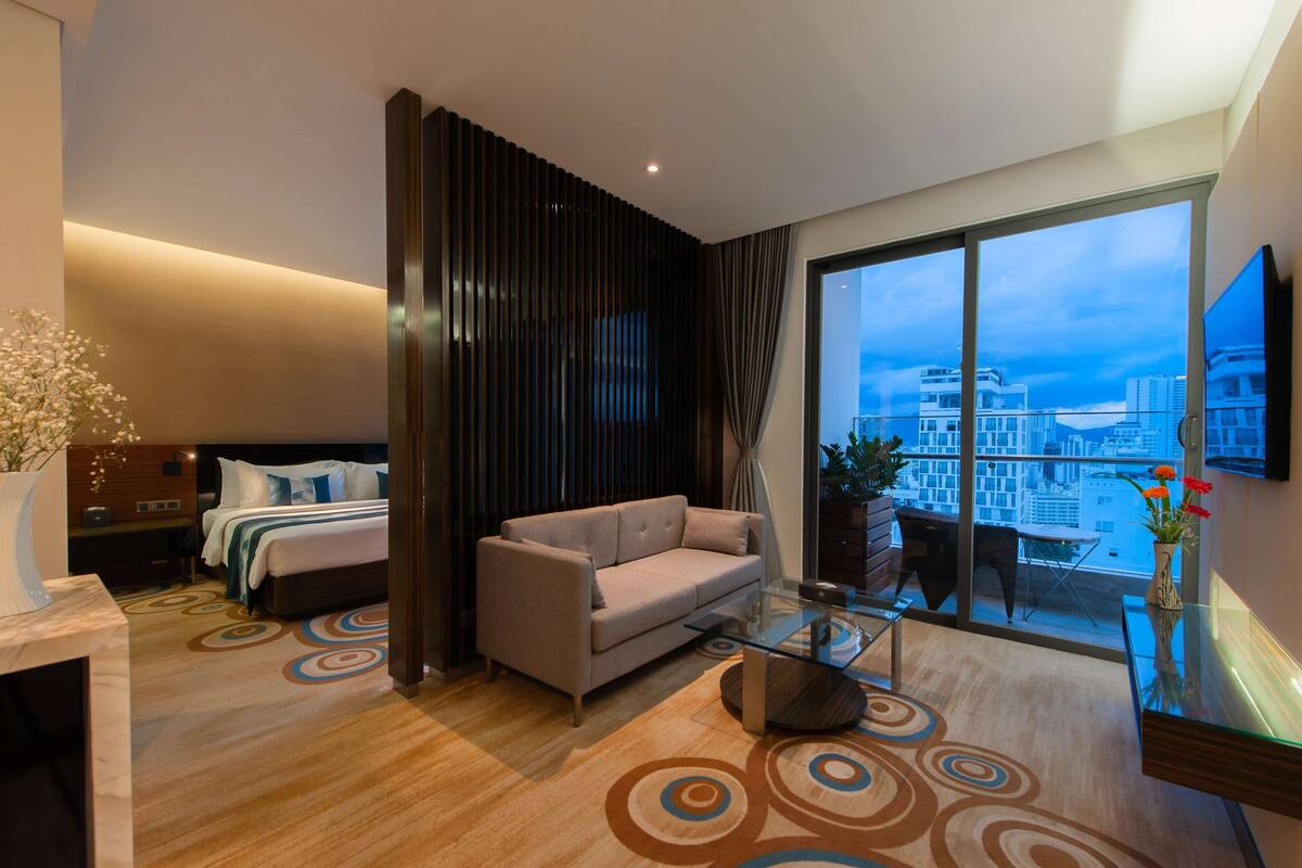 grand suite king balcony room | living area | 32-inch lcd tv with cable channels, tv, ipod dock