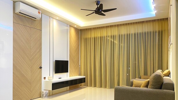A modern living room with a flat-screen TV, a ceiling fan, and a large window with curtains. - Amadel Residence (Malacca City)