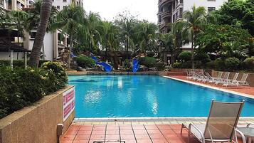 Outdoor pool, open 8:00 AM to 8:00 PM, pool loungers, lifeguards on site
