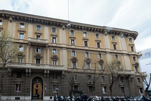 A historic building with a classical facade, multiple windows, and a prominent entrance. - Nox (Rome)