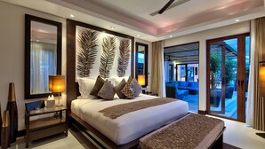 A spacious bedroom with a large bed, a ceiling fan, and a view of an outdoor area. - Lotus Samui (Koh Samui)