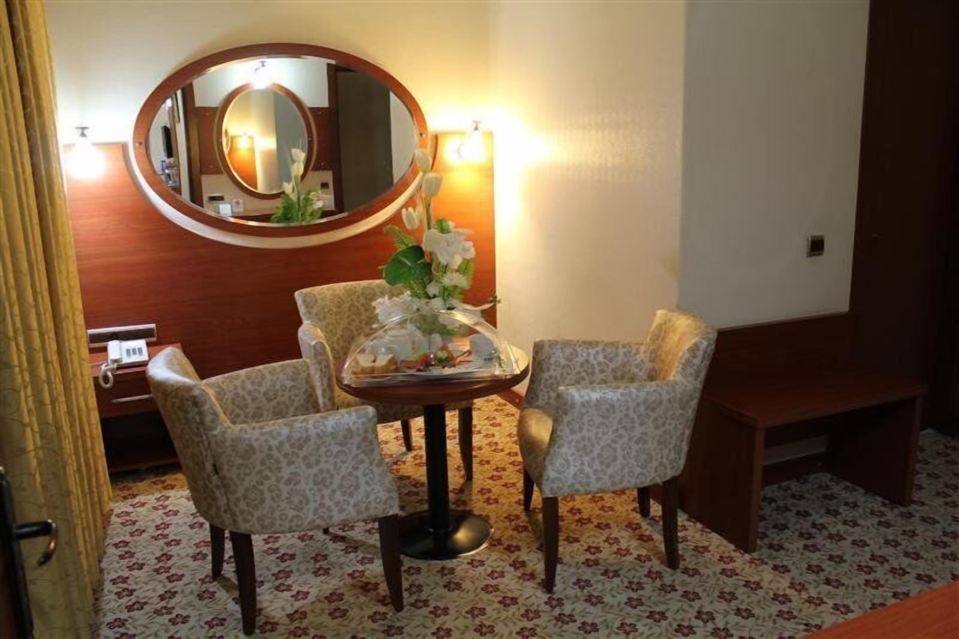 standard triple room | living area | lcd tv