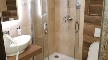 Shower, free toiletries, hair dryer, towels