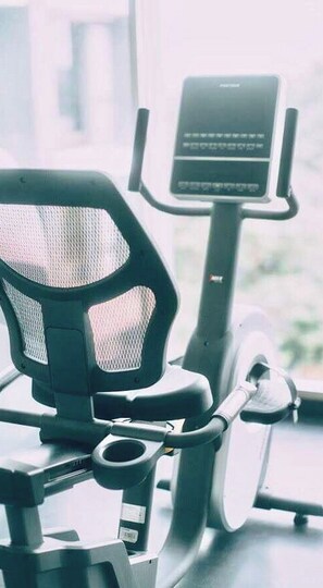 An exercise machine with a digital display and a mesh backrest chair. - Stay With Nimman Chiang Mai (Chiang Mai)